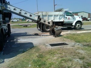 Dumptruck and equipment on road